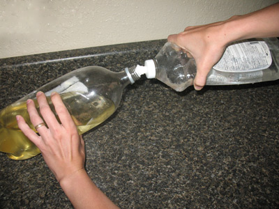 washing biodiesel - pouring water in washing biodiesel - pouring water in